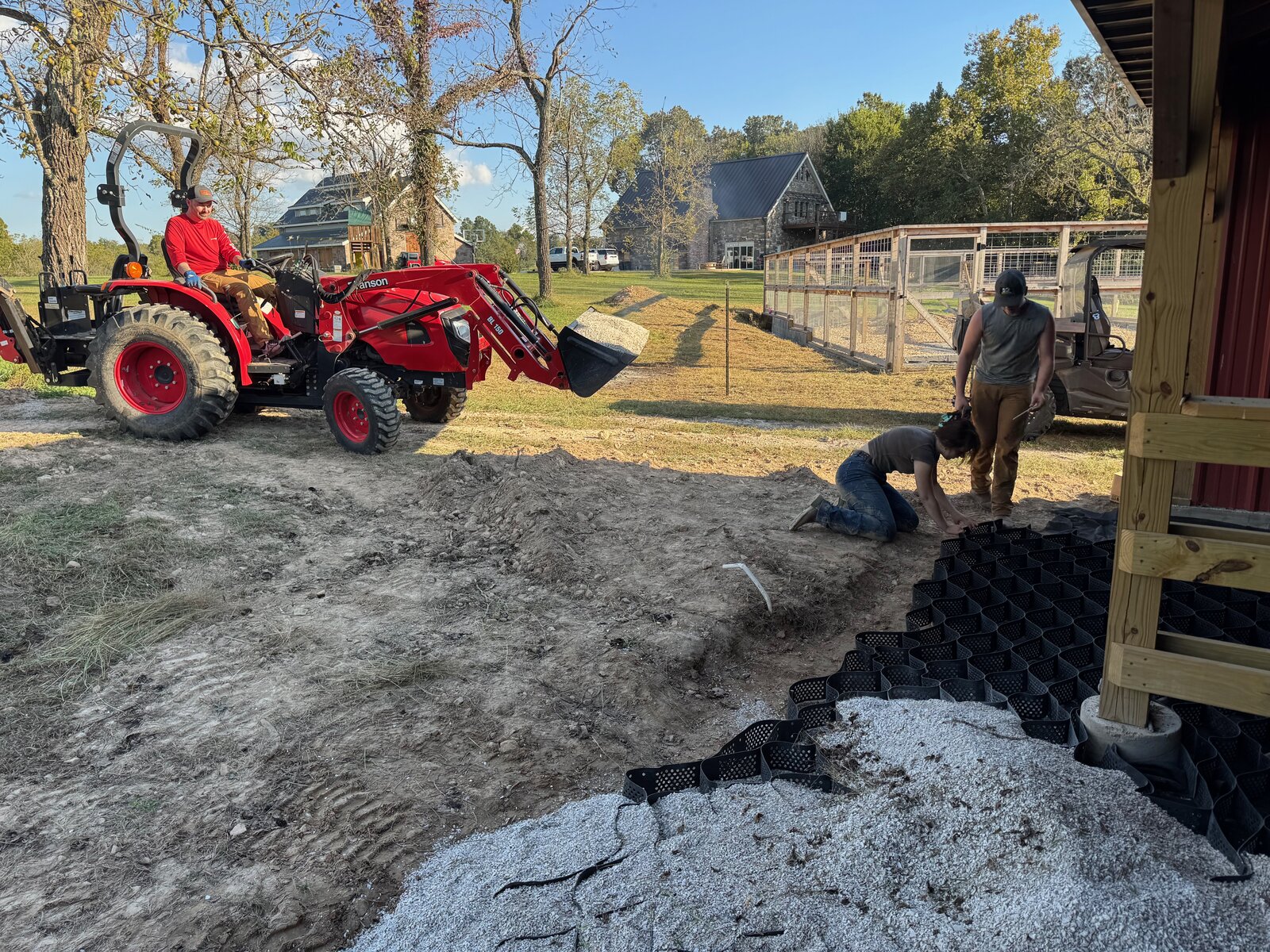 GHR tractor spreading gravel for a base prep job