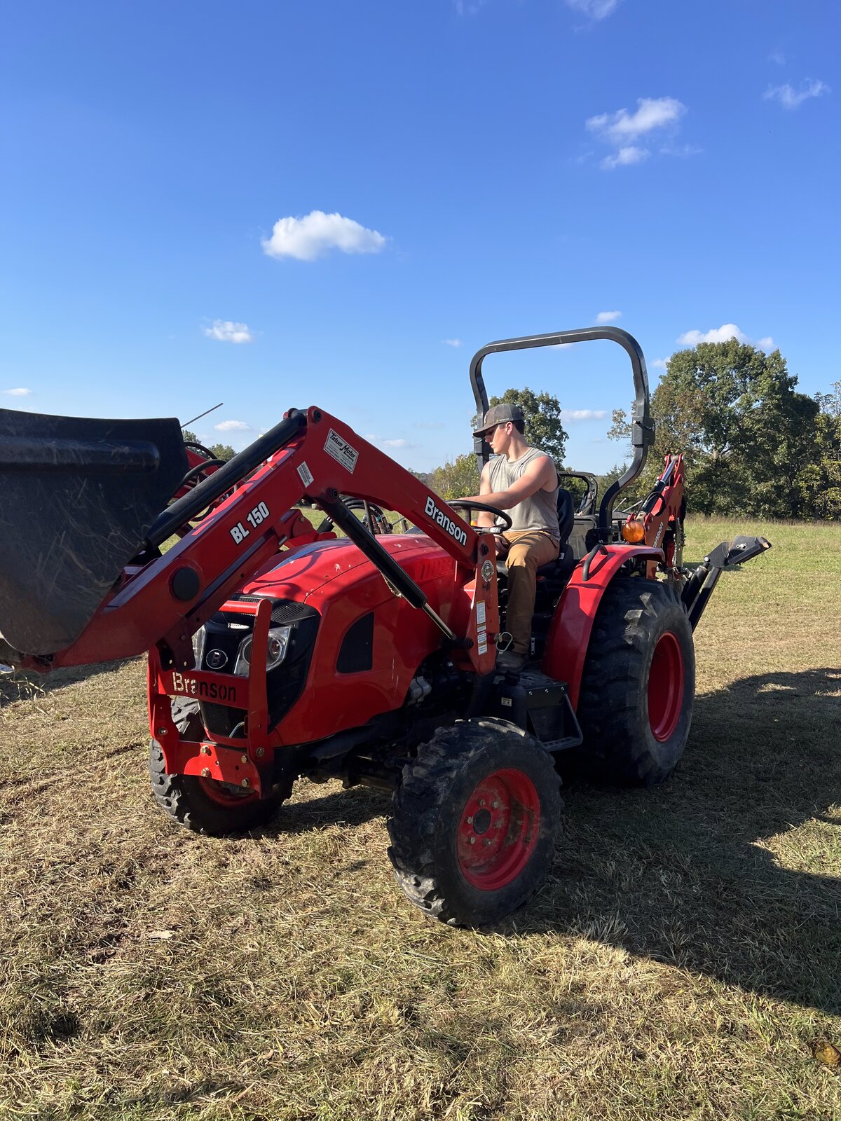 GHR loader tractor working a field in Northwest Arkansas