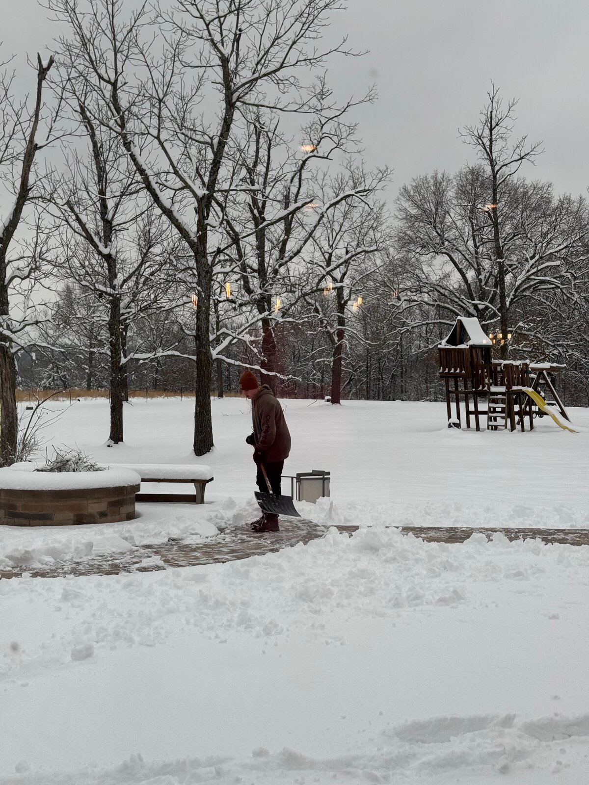 GHR shoveling a snowy walkway in Northwest Arkansas